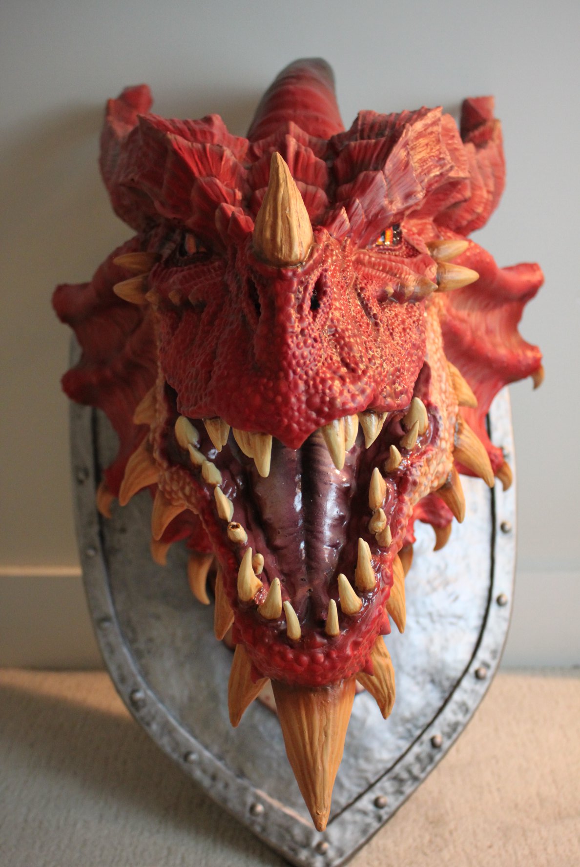 The majestic restoration of this red dragon's mounted head